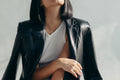 Leather jacket draped over shoulders