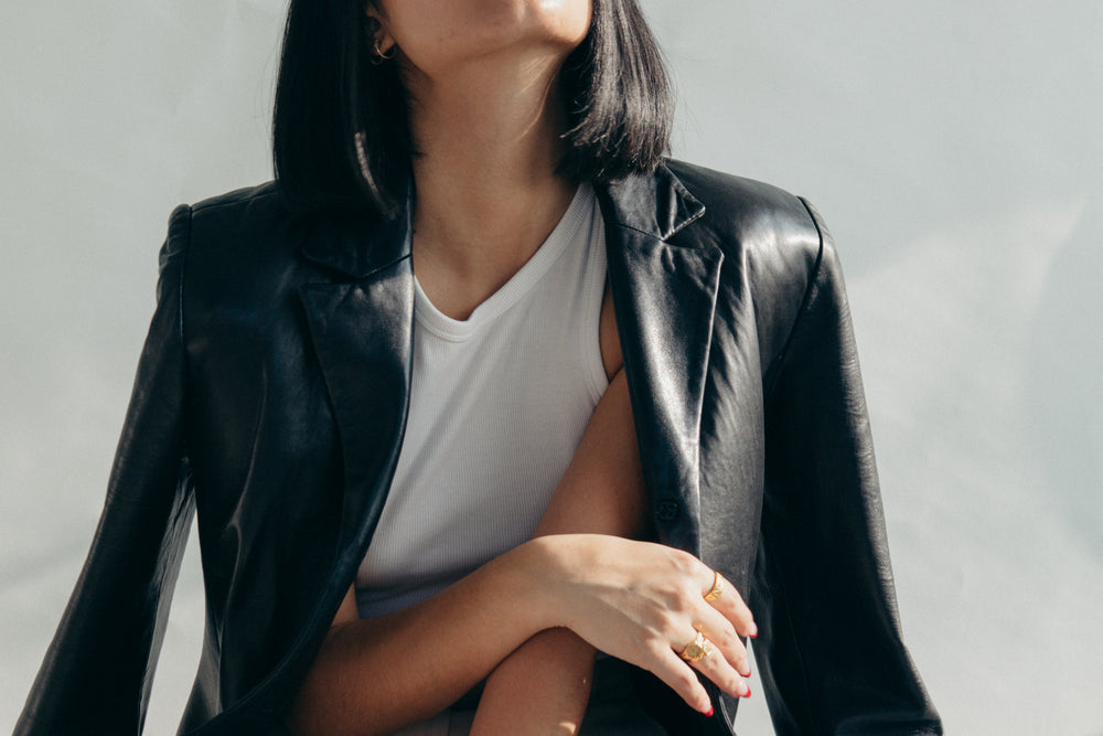 Leather jacket draped over shoulders